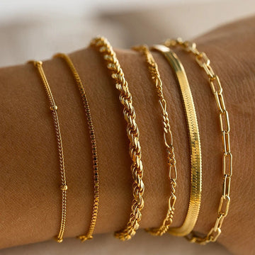 A golden six - piece set Chic Multi - Layered Alloy Bracelet Set - Fashionable Stackable Jewelry - RnR Galore